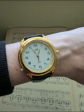 Vintage Timex Indiglo Gold-Tone Watch with Black Strap